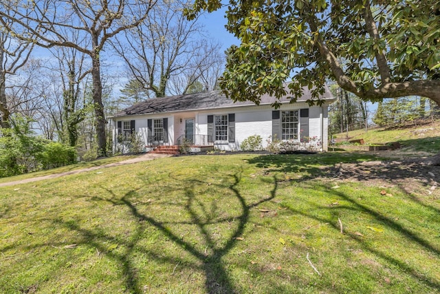 ranch-style house with a front lawn