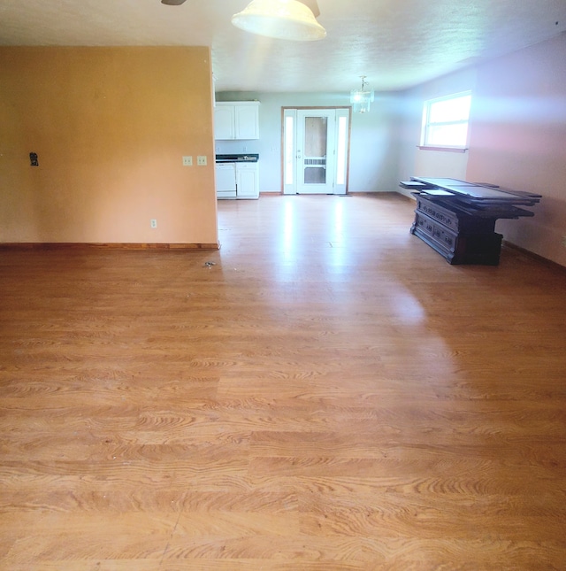 unfurnished living room featuring light hardwood / wood-style flooring