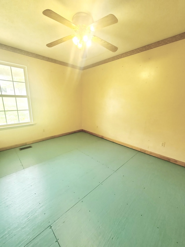 empty room featuring ceiling fan