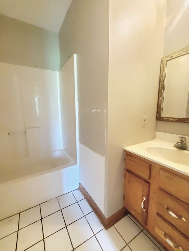 bathroom featuring washtub / shower combination, tile flooring, and vanity