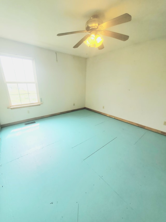 unfurnished room featuring ceiling fan