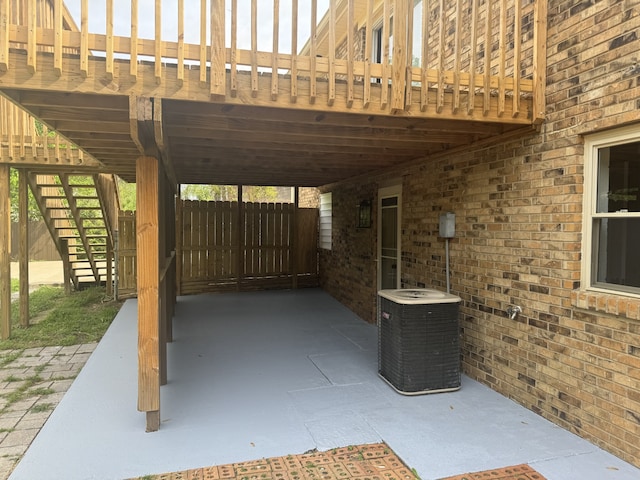 view of patio with a pergola and central AC unit