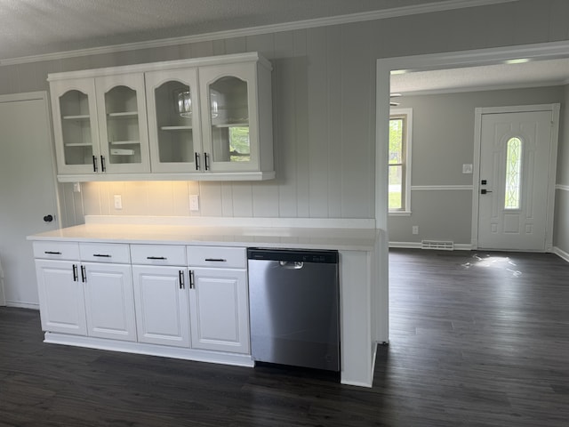 interior space with a textured ceiling, dark hardwood / wood-style flooring, white cabinetry, and stainless steel dishwasher