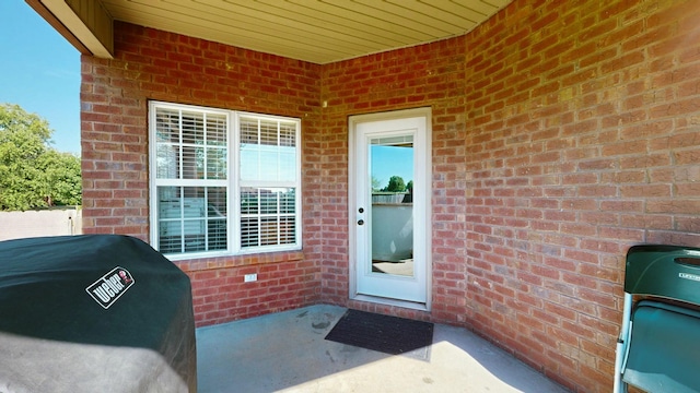 entrance to property featuring a patio