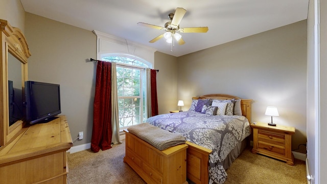 carpeted bedroom featuring ceiling fan