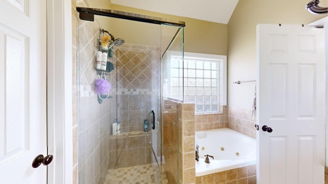 bathroom with separate shower and tub