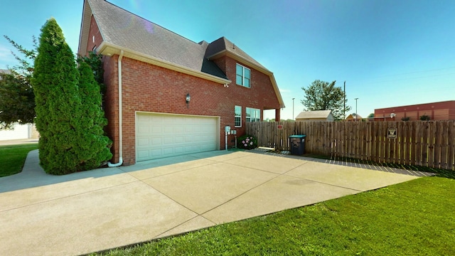 view of side of property with a garage