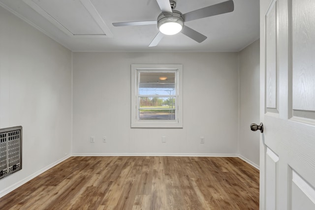 empty room featuring wood-type flooring and ceiling fan