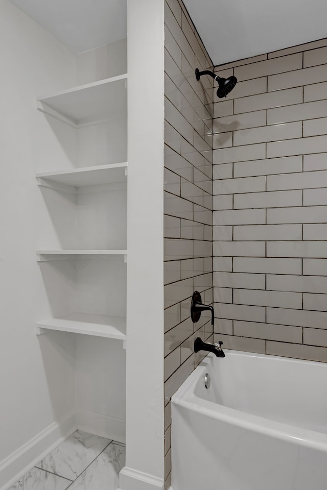 bathroom with tile flooring and tiled shower / bath combo