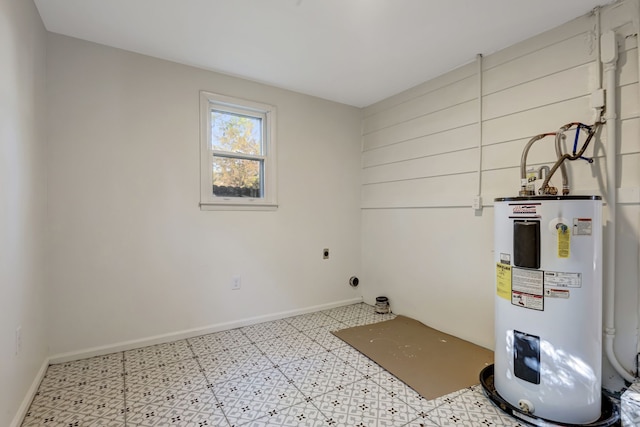 washroom featuring electric water heater, light tile floors, and electric dryer hookup