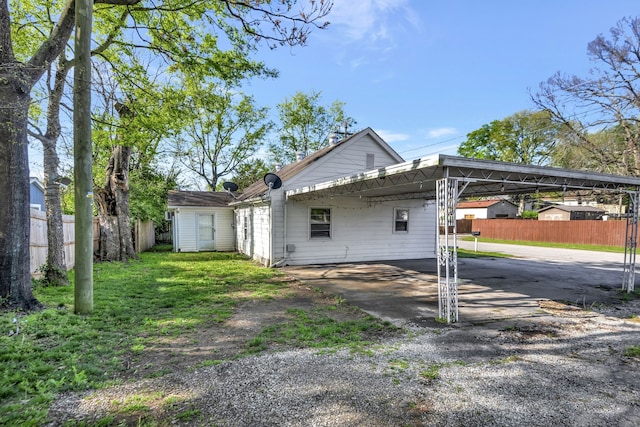 rear view of house with a carport