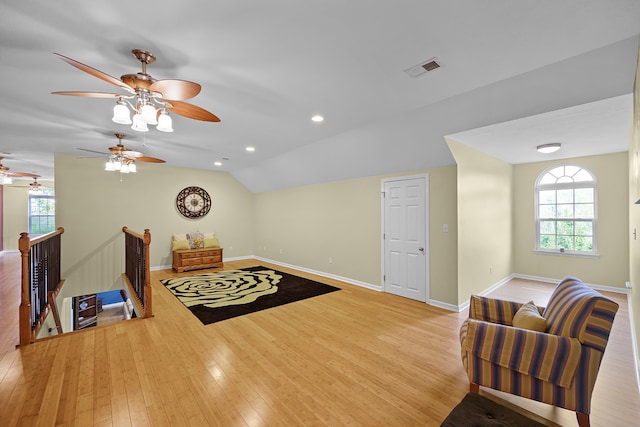 interior space featuring vaulted ceiling, light hardwood / wood-style floors, and ceiling fan