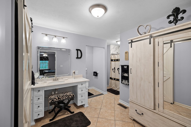 bathroom featuring vanity and tile flooring