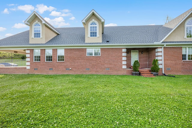 rear view of property with a yard