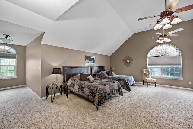 carpeted bedroom featuring vaulted ceiling, ceiling fan, and multiple windows