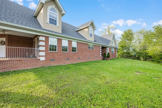 view of side of property featuring a yard