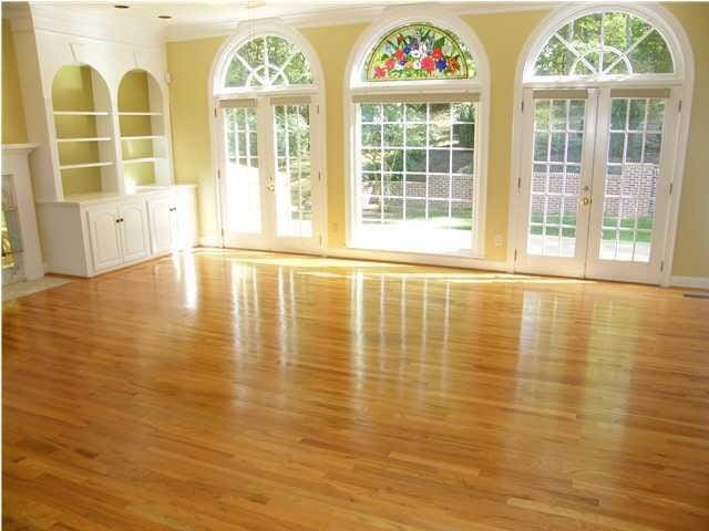 unfurnished room featuring a wealth of natural light, light hardwood / wood-style flooring, and french doors