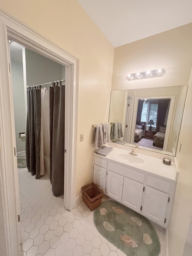 bathroom with vanity and tile flooring