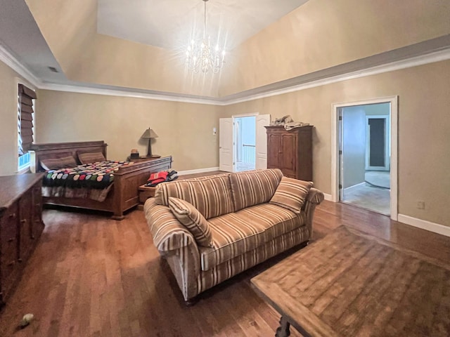 living room featuring dark hardwood / wood-style flooring, a tray ceiling, and an inviting chandelier