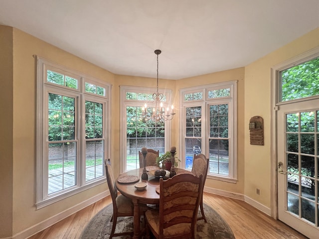 dining space with a healthy amount of sunlight and light wood-type flooring