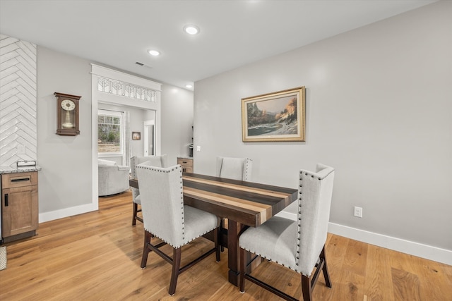 dining area featuring light wood-type flooring