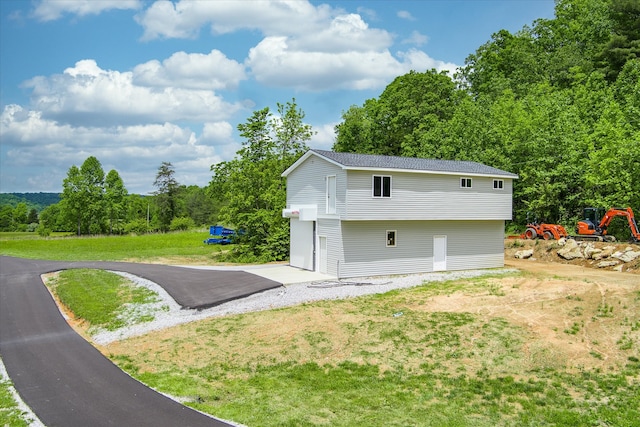 garage featuring a yard