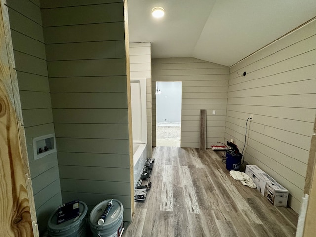 interior space featuring wood walls and hardwood / wood-style flooring