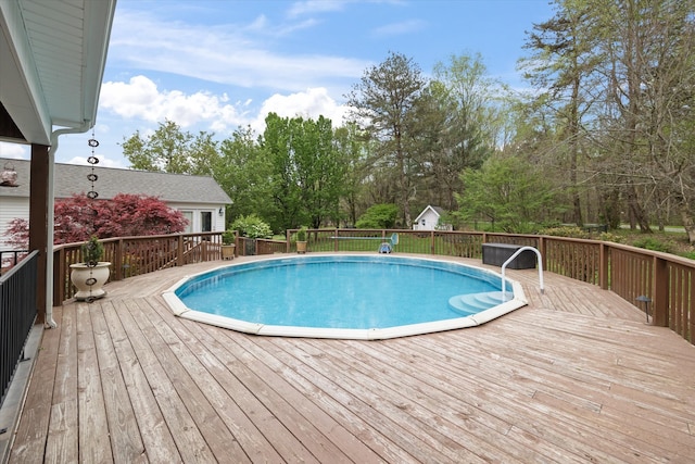 view of pool with a wooden deck