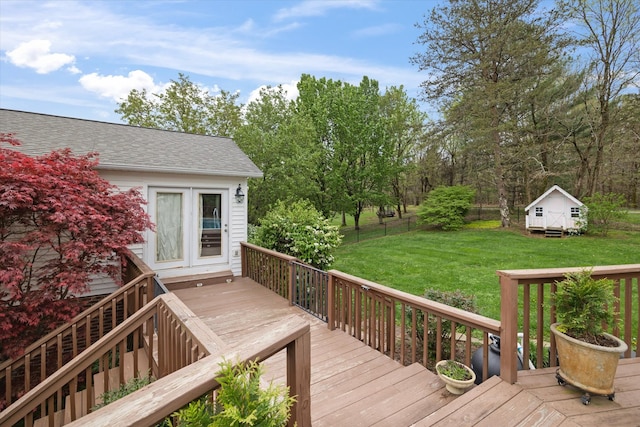 deck featuring a yard and an outdoor structure