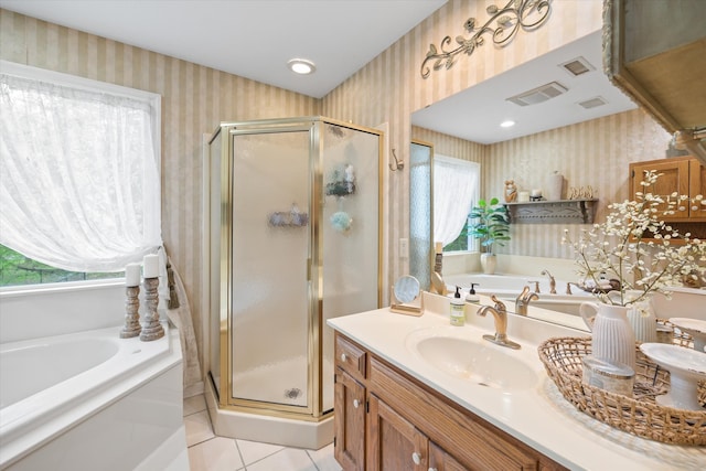 bathroom with tile flooring, vanity, and plus walk in shower