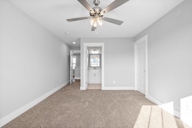 unfurnished bedroom featuring baseboards, recessed lighting, ceiling fan, light colored carpet, and connected bathroom