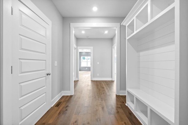 mudroom featuring visible vents, recessed lighting, dark wood-type flooring, and baseboards