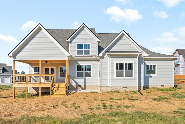 back of house featuring crawl space, ceiling fan, a deck, and roof with shingles