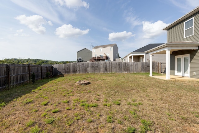 view of yard featuring a patio area and an outdoor fire pit