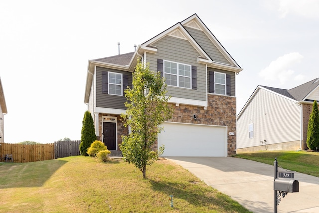 view of front of home with a front yard and a garage