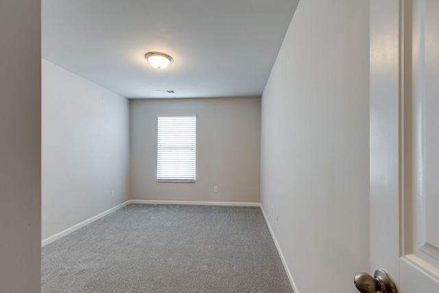 spare room with light carpet