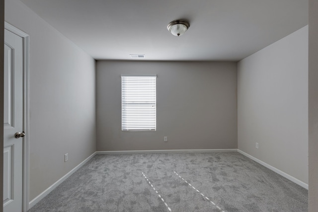 spare room with light carpet