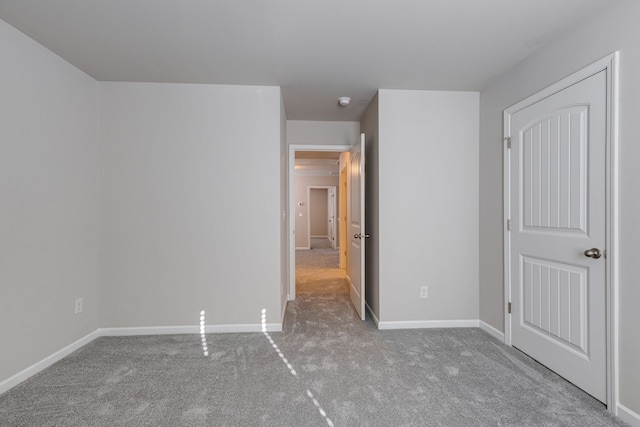 unfurnished bedroom with light carpet