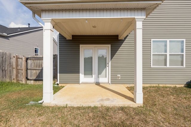 exterior space with french doors, a yard, and a patio area