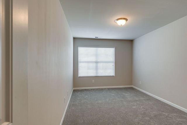 unfurnished room with carpet flooring