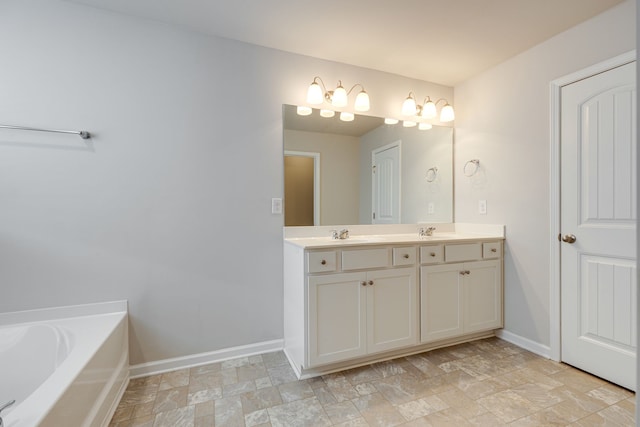 bathroom with a tub to relax in and vanity