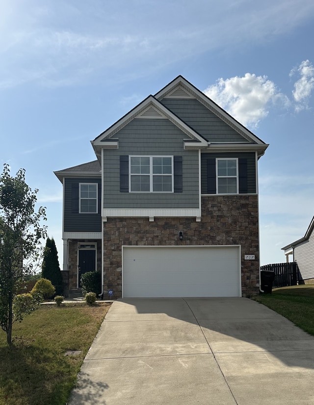 view of front facade featuring a front yard and a garage