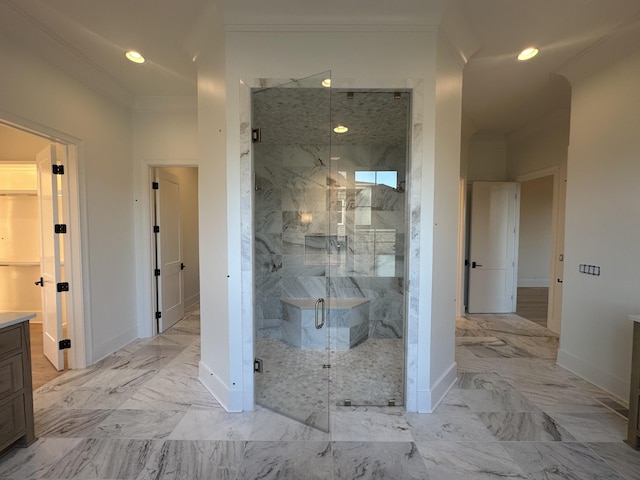 bathroom featuring crown molding, vanity, and a shower with shower door