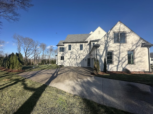 back of house with a yard