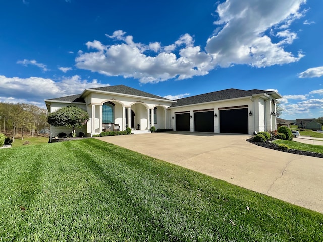 view of front of home featuring a garage and a front yard