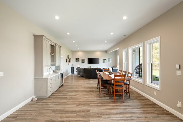 dining space with light wood-type flooring