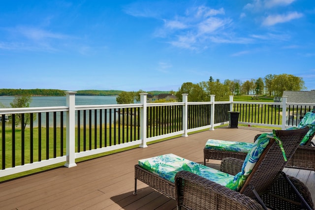 deck featuring a water view and a yard