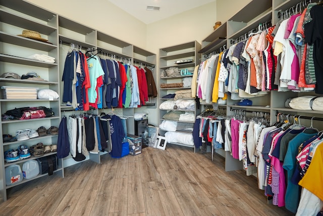 walk in closet featuring hardwood / wood-style flooring