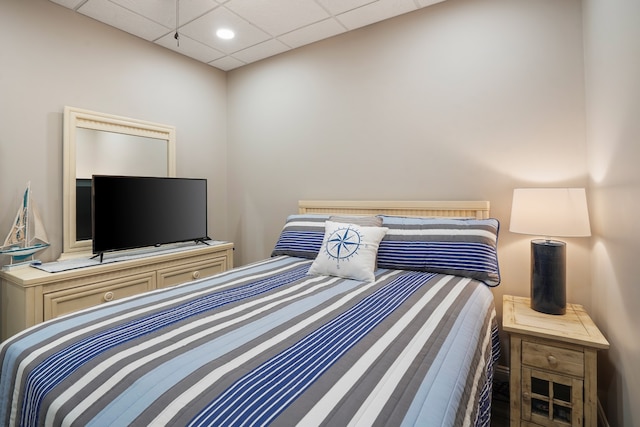 bedroom featuring a drop ceiling