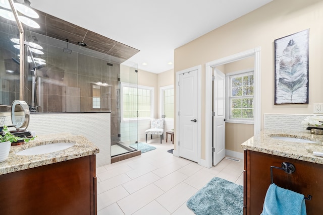 bathroom featuring tile flooring, double vanity, backsplash, and a shower with door